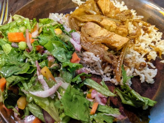 Pork in Madras sauce with brown basmati rice and a salad close up.jpg