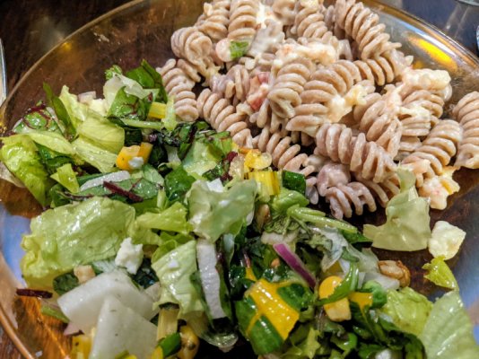 Spelt fusilli with seafood sauce and a salad close up.jpg