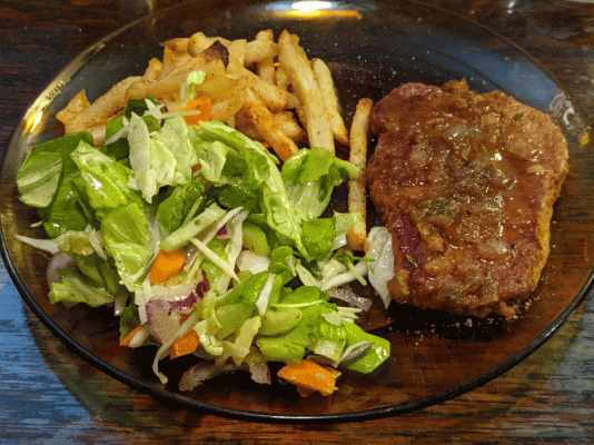 Pork chop Lyonnaise, oven  fries, and a salad with homemade vinaigrette.gif