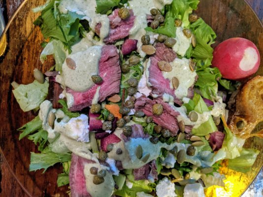 Chef's salad with steak, radishes, feta, green goddess dressing, and wholegrain baguette.jpg