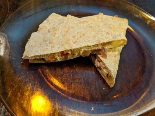 Quesadillas on multigrain tortilla with chicken, red bell pepper, onions, and cheddar.jpg