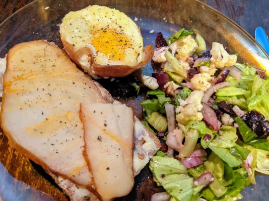 Egg cup in ham with cheese, smoked sturgeon on knækbrød, and a salad.jpg