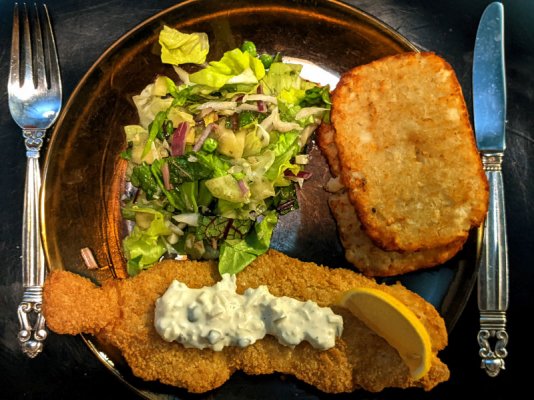 Breaded haddock, hash brown patties, remoulade, and a salad small.jpg