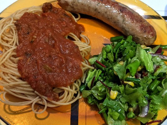 Spaghettini with pasta sauce, roasted onion sausage, and a salad.jpg