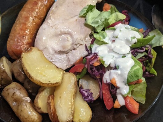 Roast chicken breast, Italian sausage, and fingerling potatoes with a salad and blue cheese dr...jpg