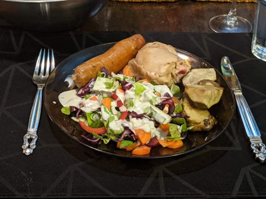 Roast chicken leg, Italian sausage, and fartichokes with a salad and blue cheese dressing.jpg