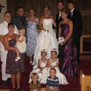 My SIL's wedding last summer. I'm in the brown dress.
I hate the tan lines with that dress...... but it fit so I was wearing it! 
I should open my eye