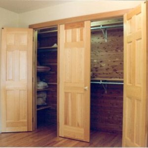 Guest Bedroom Cedar Closet, a three door closet