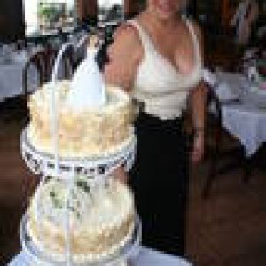 PFC John & Krissy's Wedding Cake and its baker.