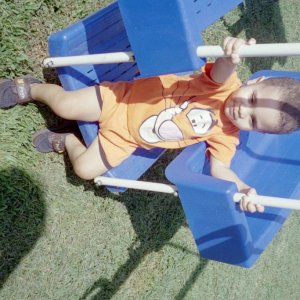 My grandson, Jerry playing on the swing set in our backyard (May 2005)