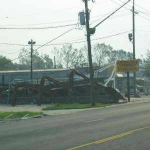 My sister took this picture on the day after Labor Day. Kenner suffered much less damage than N.O., but look what the wind did to this highway sign!