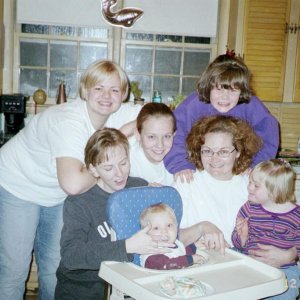 I'm the blonde, my mom is the one in gray and my sister is in white in the middle.We are at my mom's best friend Cherie''s house, the one with glasses