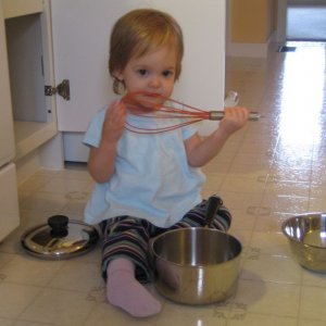 Sofie loves helping--cooking, filling the washing machine and unloading the dishwasher are her current favorites!