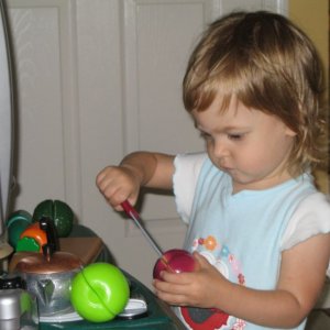 Sofie loves playing in the kitchen, mine or hers.  Most creations involve "cutting", and she loves to talk to herself while she cooks, saying "chef's 