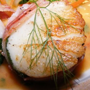 Scallops wrapped in sage and pancetta with herb beurre blanc