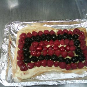 This was made by one of my year 9s (13/14 years old). A puff pastry based covered by pastry cream and decorated with fresh fruit.