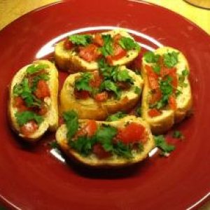 Bruschetta with chopped garlic, fresh tomatoes, parsley and olive oil,