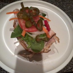 My Turkey and cappy with Shredded carrots, onion, tomatos, jalapenos, spinach, mayo plus a sprinkle of white vinegar on the veggies.