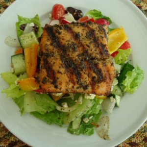 Greek-Inspired Salad topped with Grilled Salmon