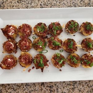 Something different ... Loaded Tater Tot Cups filled with Cheese, Sour Cream, Bacon and topped with Green Onions.
