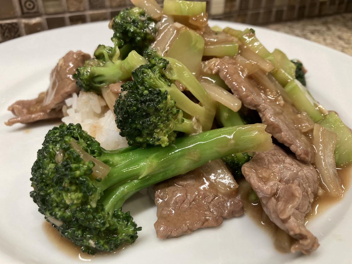 Beef Broccoli made with very thinly sliced NY Strip served over the ever present steamed White Rice