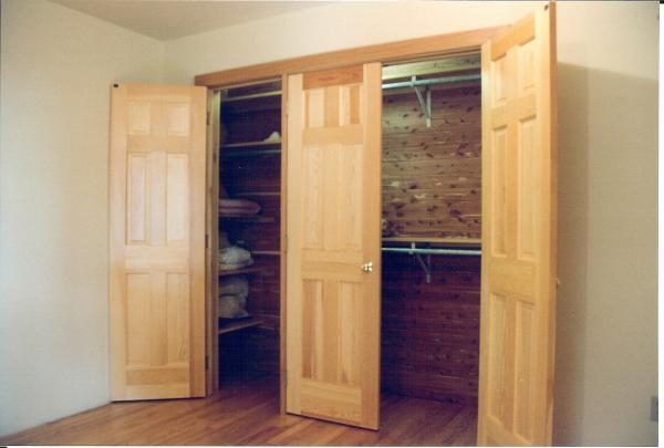 Guest Bedroom Cedar Closet, a three door closet