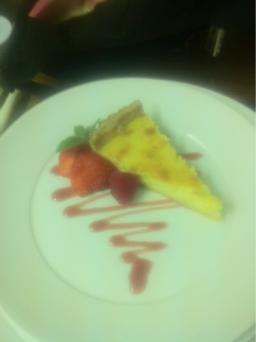Home made Lemmon tart, served with fresh berries and raspberry coulis.