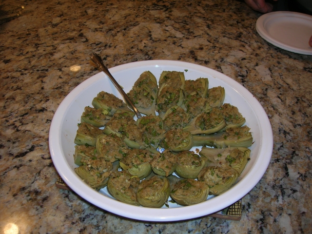 I created these by cleaning and preparing baby artichokes and then making an Italian stuffing with breadcrumbs, egg white, cheese, garlic, Parsley, S&