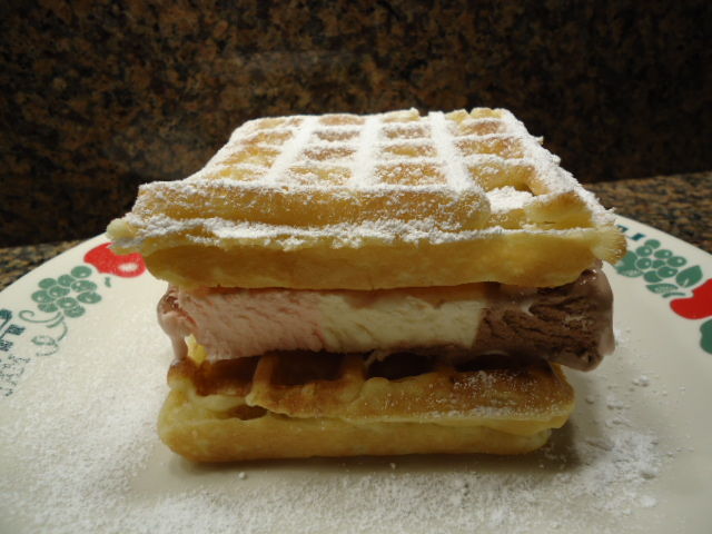 ice cream sandwich, made with Neapolitan Ice Cream Block and leftover Waffles... don't forget the dusting of powdered sugar