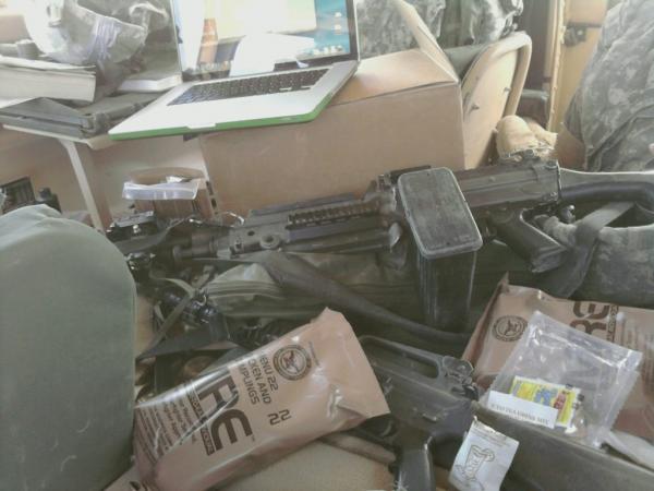 Inside a messy humvee.  In a combat environment this would be a no go.  Loose objects and an extreme safety violation!  Overall this is all you need. 