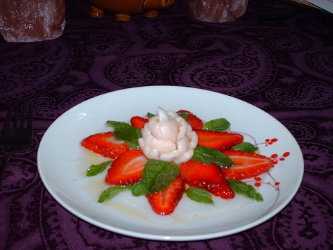 Lychee nut flower with strawberries and mint, drizzled with White Truffle Oil.