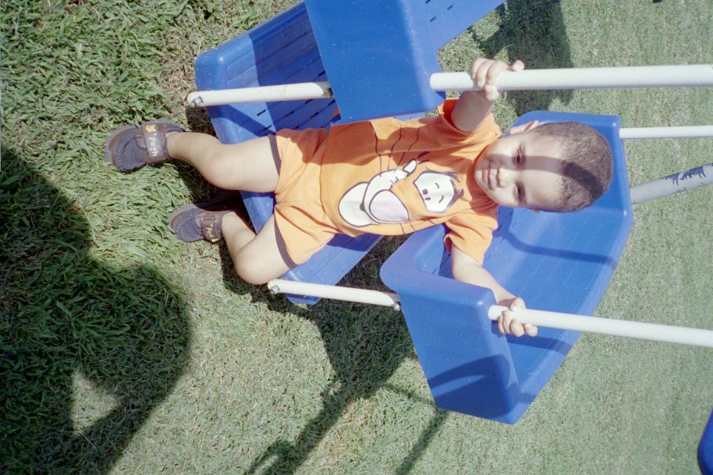 My grandson, Jerry playing on the swing set in our backyard (May 2005)