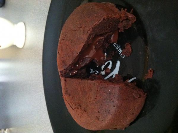 My molten lava cake with hot, warm chocolate flowing out of the middle of a chocolate cake!