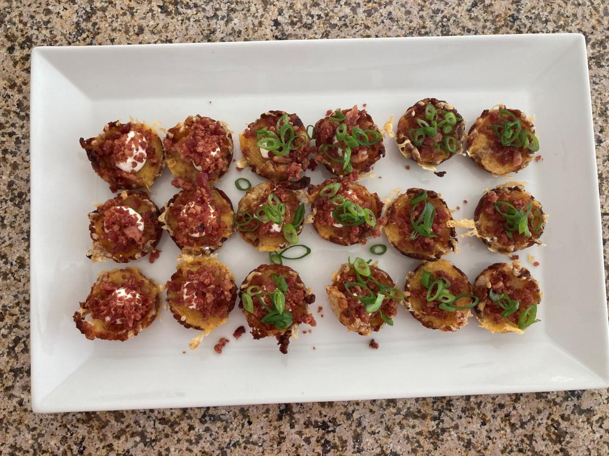 Something different ... Loaded Tater Tot Cups filled with Cheese, Sour Cream, Bacon and topped with Green Onions.