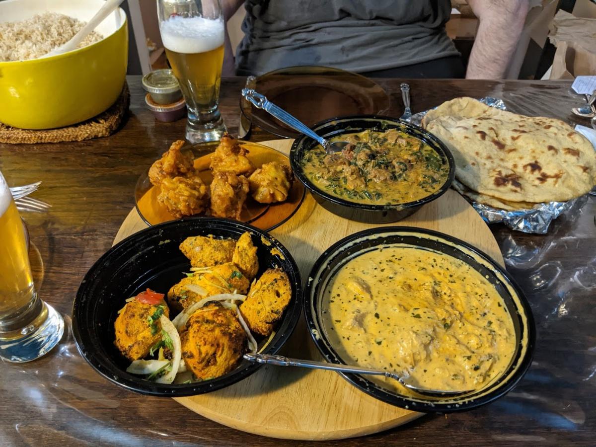 Supper delivered from Sahib, a local Indian resto.

Clockwise on the lazy Susan, starting at the top left: onion bhajis, methi gosht (lamb), chicken k