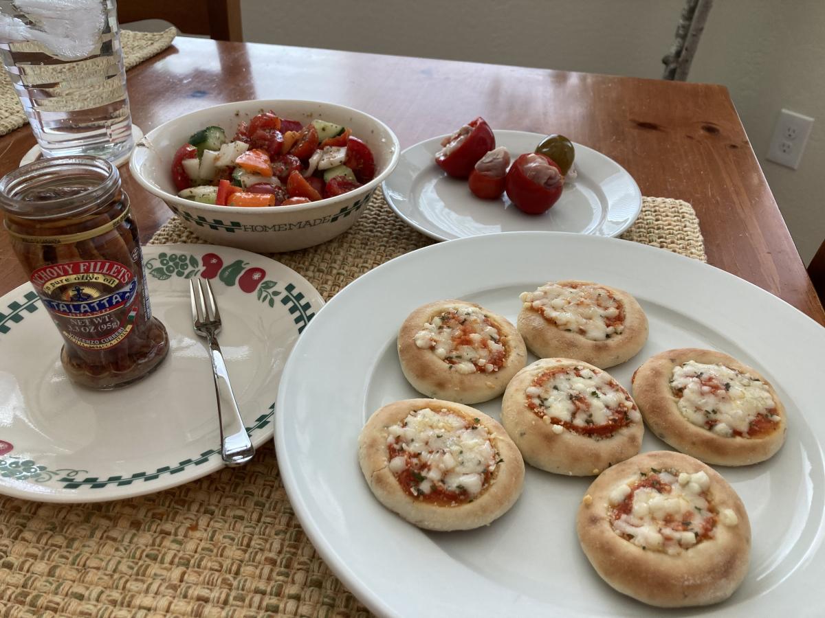 Trader Joe's Mini Pizzas with a Chopped Salad, Anchovies on the side and Stuffed Hot Cherry Peppers, my husband was in heaven!